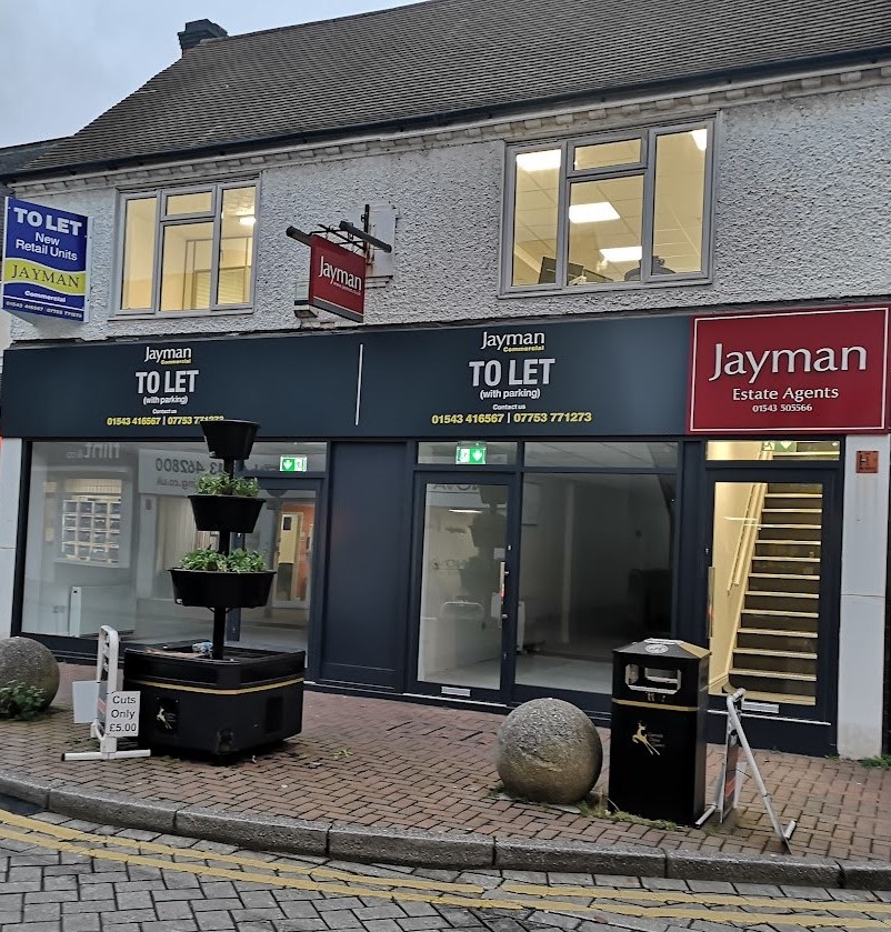 Aluminium shopfront with windows above on a Jayman commercial unit – Prestige Aluminium Systems