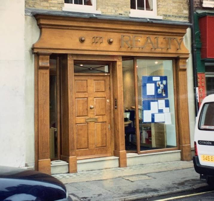 Realty — bespoke timber shopfront with panelled entrance door – Prestige Aluminium Systems